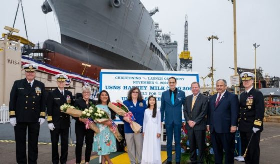 Special guests, speakers, and Navy personnel stand in front of the USNS Harvey Milk during its christening in San Diego, California, on Saturday.