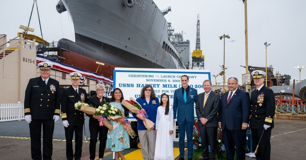 Special guests, speakers, and Navy personnel stand in front of the USNS Harvey Milk during its christening in San Diego, California, on Saturday.