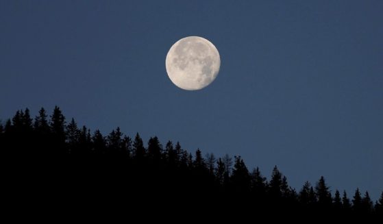 The moon is seen setting near Vipiteno, Italy, on Nov. 21.