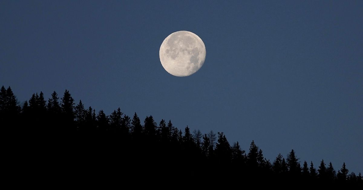 The moon is seen setting near Vipiteno, Italy, on Nov. 21.