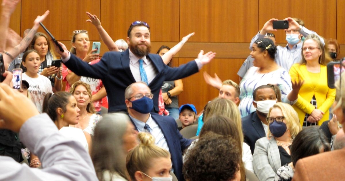 A large group of parents in Baton Rouge, Louisiana, attended a school board meeting on Aug. 18 to protest Gov. John Bel Edwards' school mask mandate.