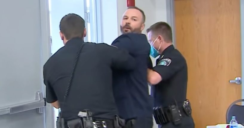 Dustin Clark, a parent, was forcibly removed from a Round Rock Independent School board meeting in Round Rock, Texas, in September.