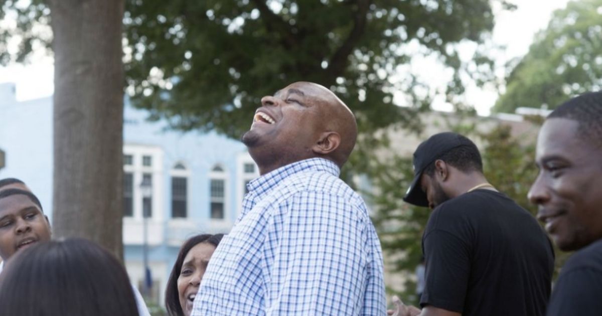 Dontae Sharpe breathes fresh air after a judge determined he could be freed Aug. 22, 2019. North Carolina Gov. Roy Cooper pardoned Sharpe on Friday after he spent 24 years behind bars for a murder he did not commit.