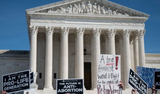 Pro-life activists rally at the U.S. Supreme Court in Washington on Oct. 2.