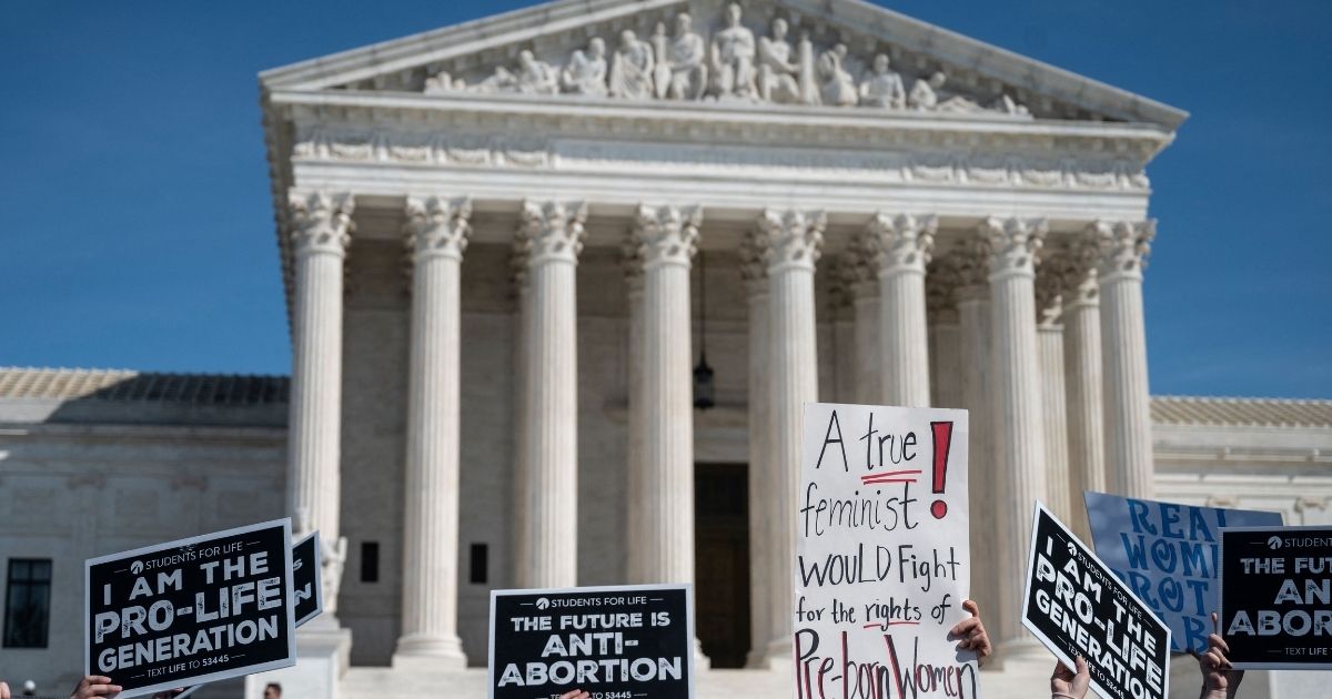 Pro-life activists rally at the U.S. Supreme Court in Washington on Oct. 2.