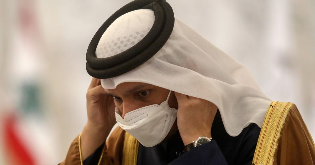 Qatar's Deputy Prime Minister and Foreign Minister Sheikh Mohammed bin Abdulrahman bin Jassim Al-Thani wears a face mask to protect against the spread of the coronavirus, before a news conference in February 2021. A new study of citizens of Qatar found natural immunity to be surprisingly strong, with few COVID reinfections and no deaths.