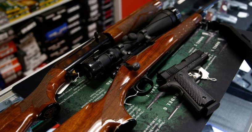 A Remington hunting rifle, a Remington shotgun and a Remington pistol are seen for sale at Atlantic Outdoors gun shop on March 26, 2018, in Stokesdale, North Carolina.