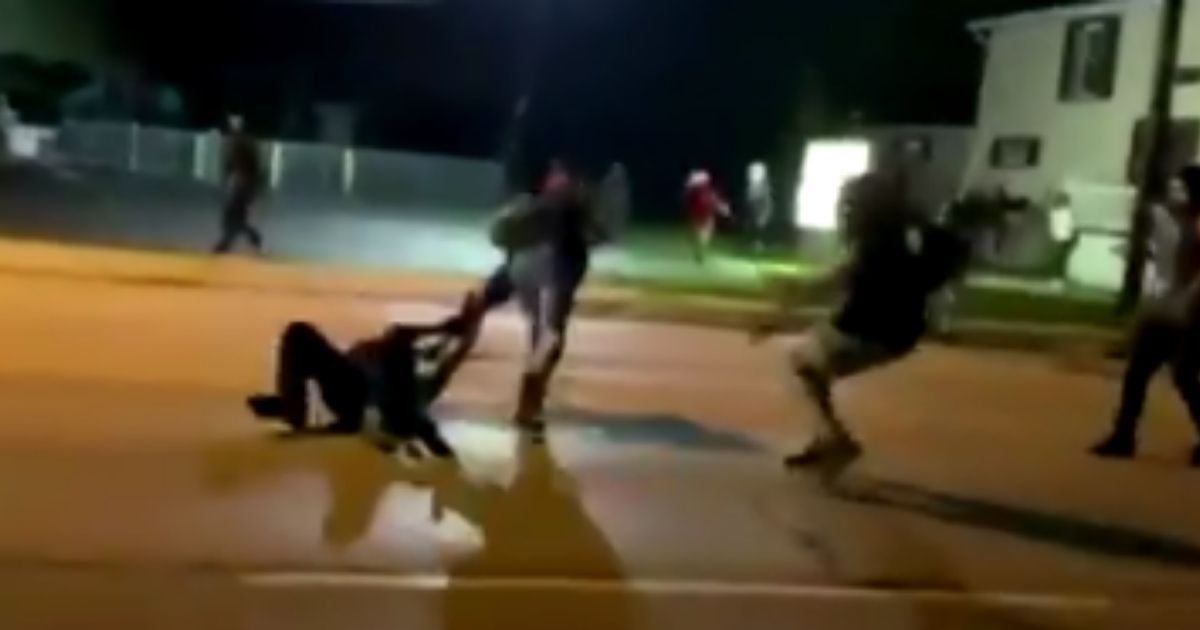 Video footage from Aug. 25, 2020, shows Kyle Rittenhouse on the ground and being attacked by several people as he attempts to make his way to the police line set up in Kenosha, Wisconsin.