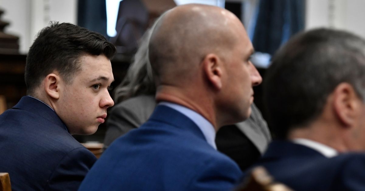 Kyle Rittenhouse listens as the attorneys and the judge talk about jury instructions at the Kenosha County Courthouse on Monday in Kenosha, Wisconsin.