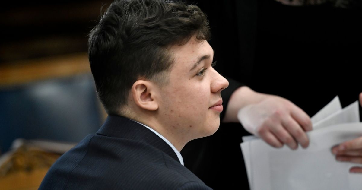 Kyle Rittenhouse waits for the day to begin during his trial at the Kenosha County Courthouse in Kenosha, Wisconsin, on Friday.