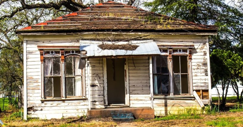 This images shows a run-down house in need of many repairs, as was the house in this story.