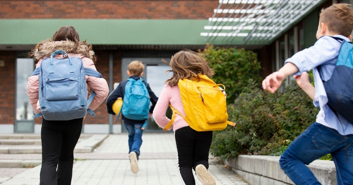This stock image shows a group of schoolchildren running toward a building. Allyn Walker, an assistant professor at Old Dominion University in the department of sociology and criminal justice, believes pedophilia should be de-stigmatized.