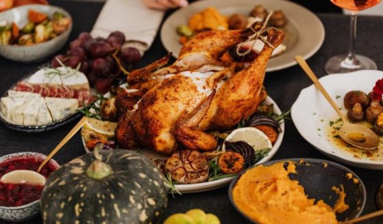 This stock image shows a table filled with Thanksgiving dinner essentials.
