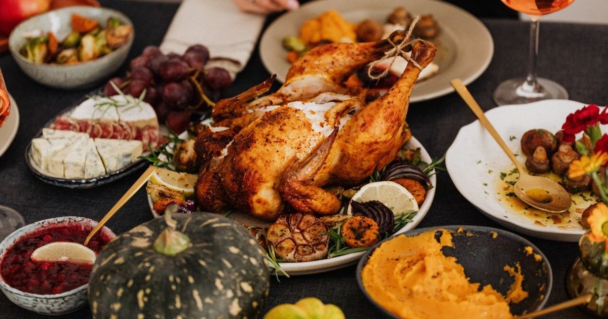 This stock image shows a table filled with Thanksgiving dinner essentials.