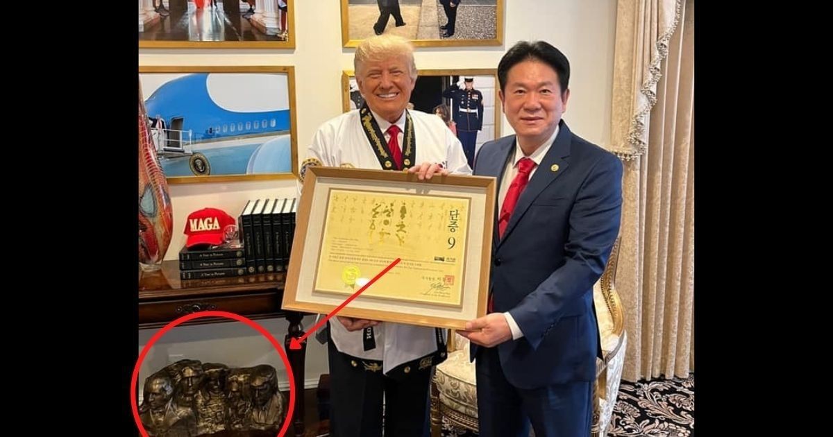 Former President Donald Trump poses with Kukkiwon President Lee Dong-sup.