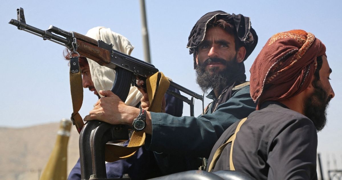 Taliban fighters stand guard in Kabul, Afghanistan, on Aug. 16.