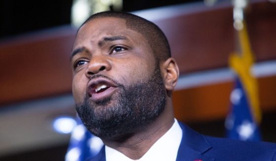 Republican Florida Rep. Byron Donalds and other House Republicans discuss the Democrats' spending package at the U.S. Capitol on Tuesday in Washington, D.C.