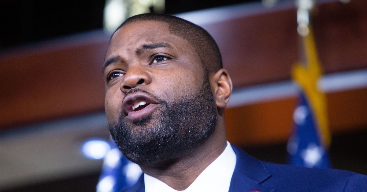 Republican Florida Rep. Byron Donalds and other House Republicans discuss the Democrats' spending package at the U.S. Capitol on Tuesday in Washington, D.C.