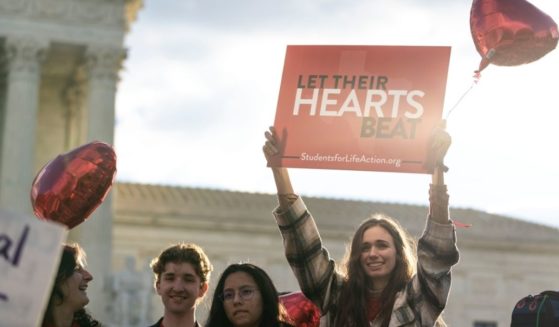 Pro-life demonstrators rally outside the Supreme Court in Washington, D.C., on Monday.