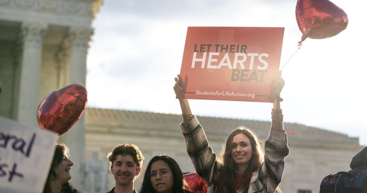 Pro-life demonstrators rally outside the Supreme Court in Washington, D.C., on Monday.