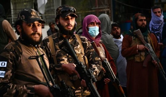 Taliban fighters stand guard near the Sardar Mohammad Dawood Khan military hospital in Kabul, Afghanistan, on Tuesday.