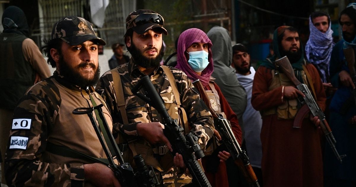 Taliban fighters stand guard near the Sardar Mohammad Dawood Khan military hospital in Kabul, Afghanistan, on Tuesday.