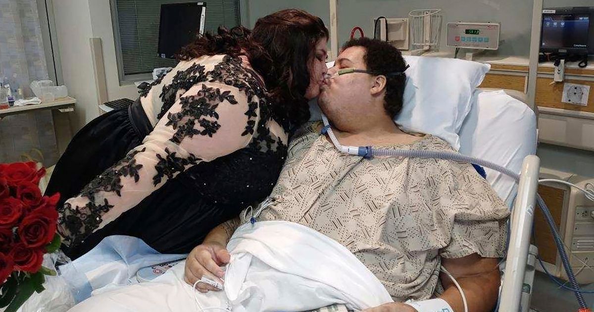 Jonathan Johnson kisses his fiancée, Mariah Copeland, in the Critical Care Unit at Methodist Jennie Edmundson Hospital in Council Bluffs, Iowa, on Oct. 14.