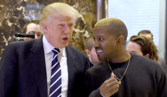 Then-President-elect Donald Trump appears with entertainer Kanye West in New York City's Trump Tower in December 2016.