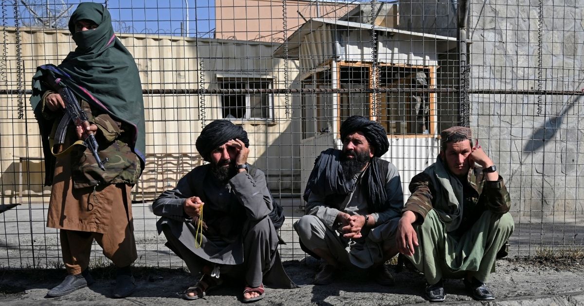 Taliban fighters stand outside an entrance gate of the Sardar Mohammad Dawood Khan military hospital in Kabul, Afghanistan, on Nov. 3.