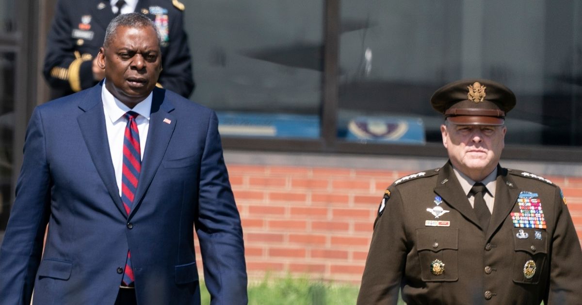 Defense Secretary Lloyd Austin, left, and Army Gen. Mark Milley, chairman of the Joint Chiefs of Staff, are picture in a July file photo at Andrews Air Force Base in Maryland.