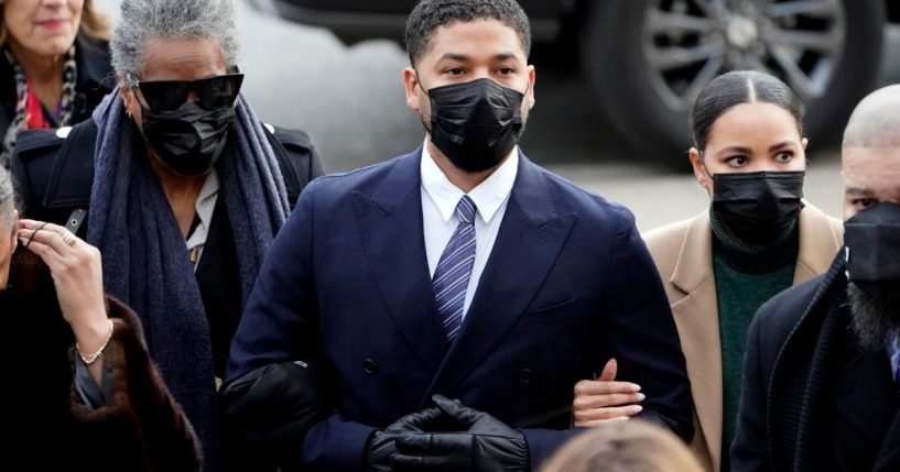 Actor Jussie Smollett walks with family members as they arrive at the Leighton Criminal Courthouse in Chicago on Nov. 29, 2021, for jury selection at his trial. Smollett is accused of lying to police when he reported he was the victim of a racist, anti-gay attack in downtown Chicago nearly three years ago.