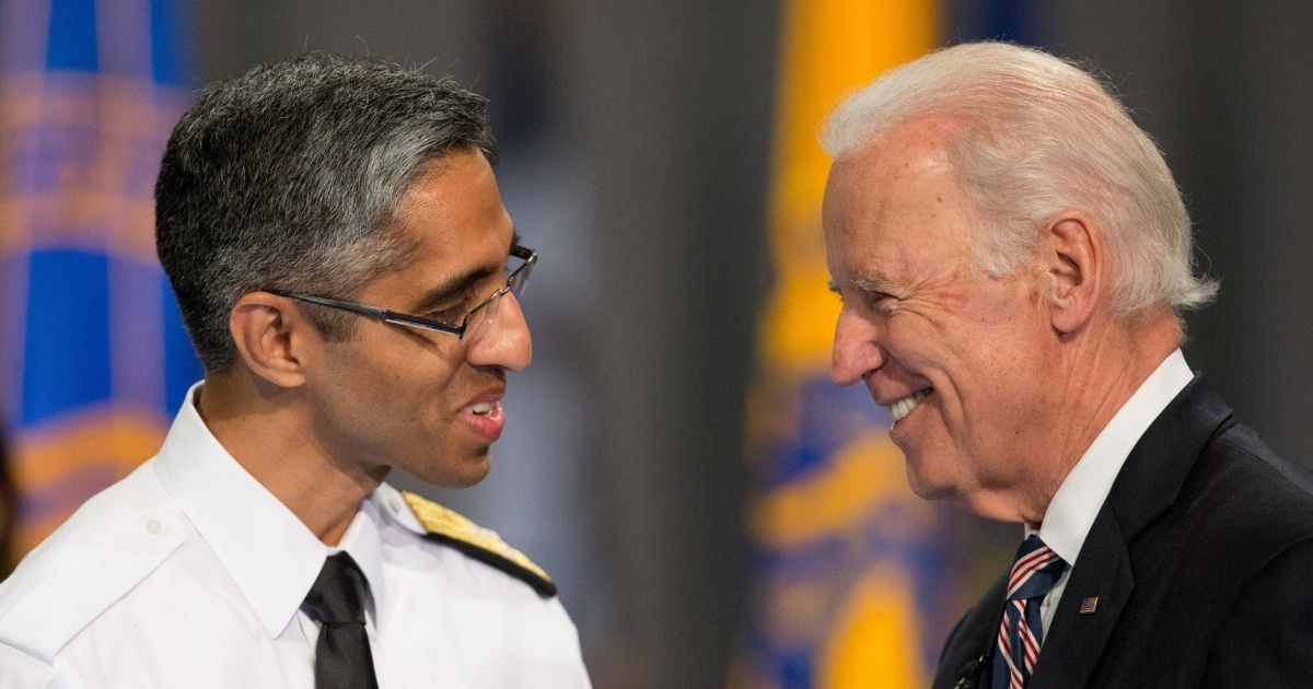 U.S. Surgeon General Vivek Murthy, left, and then-Vice President Joe Biden in Fort Myer in Virginia on April 22, 2015.