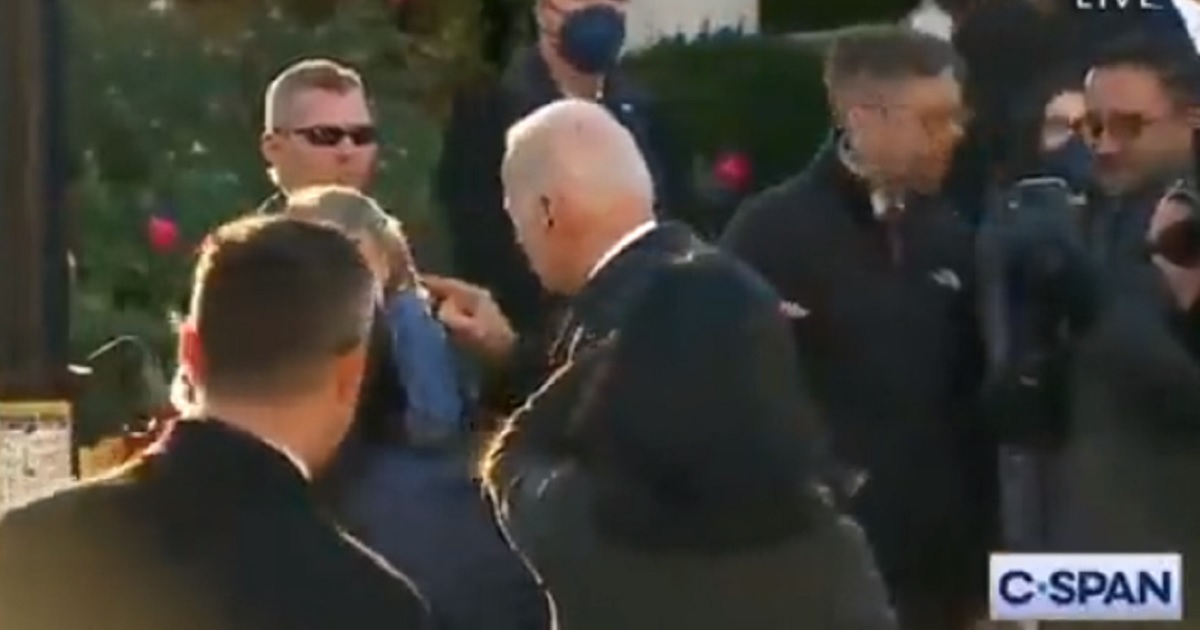 Joe Biden pokes a little girl at the White House on Nov. 19.