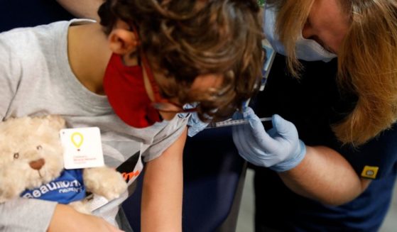 A child receives Pfizer's COVID-19 vaccine in Southfield, Michigan, on Friday.