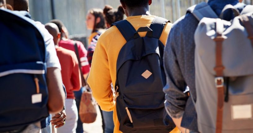 Students wearing backpacks are seen in the above stock image.