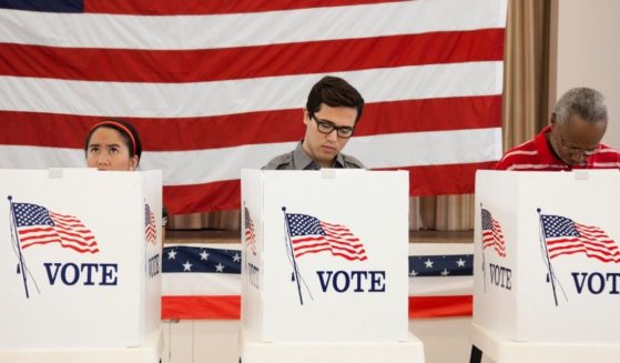 Voters cast their ballots in this stock image.