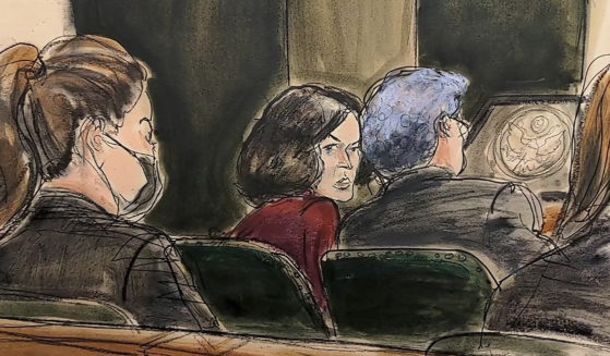 In this courtroom sketch, Ghislaine Maxwell center, confers with her defense attorney Jeffrey Pagliuca, right, before testimony was to begin in her sex-abuse trial in New York Wednesday. Testimony was halted Thursday due to an attorney's illness.
