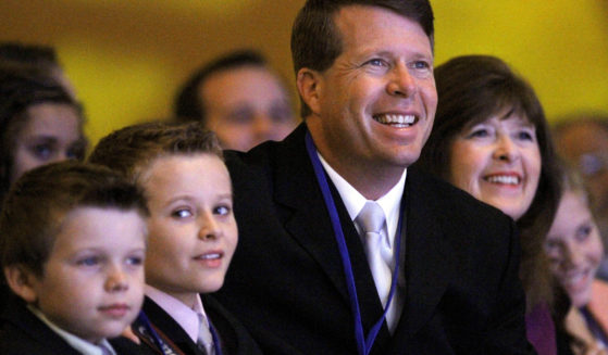 Jim Bob Duggar and his family listen as former Arkansas Gov. Mike Huckabee speaks to the Values Voter Summit on Sept. 17, 2010, in Washington.