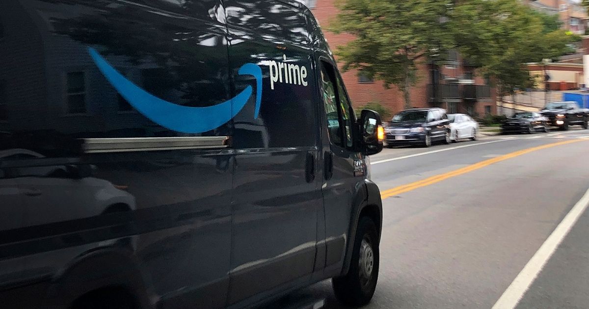 An Amazon delivery truck moves through a neighborhood in Boston, Massachusetts, on Oct. 2, 2020.