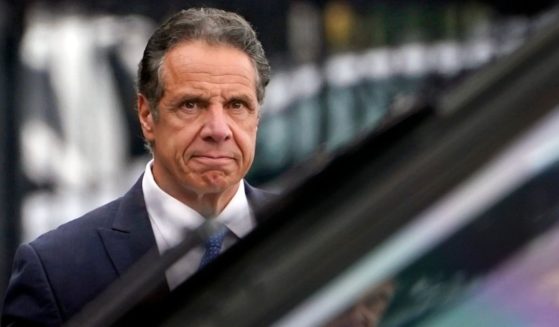 Then-New York Gov. Andrew Cuomo prepares to board a helicopter after announcing his resignation on Aug. 10 in New York.
