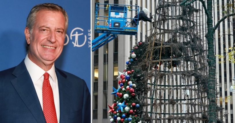 Mayor Bill de Blasio attends a gala at the American Museum of Natural History on Nov. 18 in New York City. A worker disassembles a Christmas tree outside Fox News headquarters in New York on Wednesday after a man allegedly set it on fire.