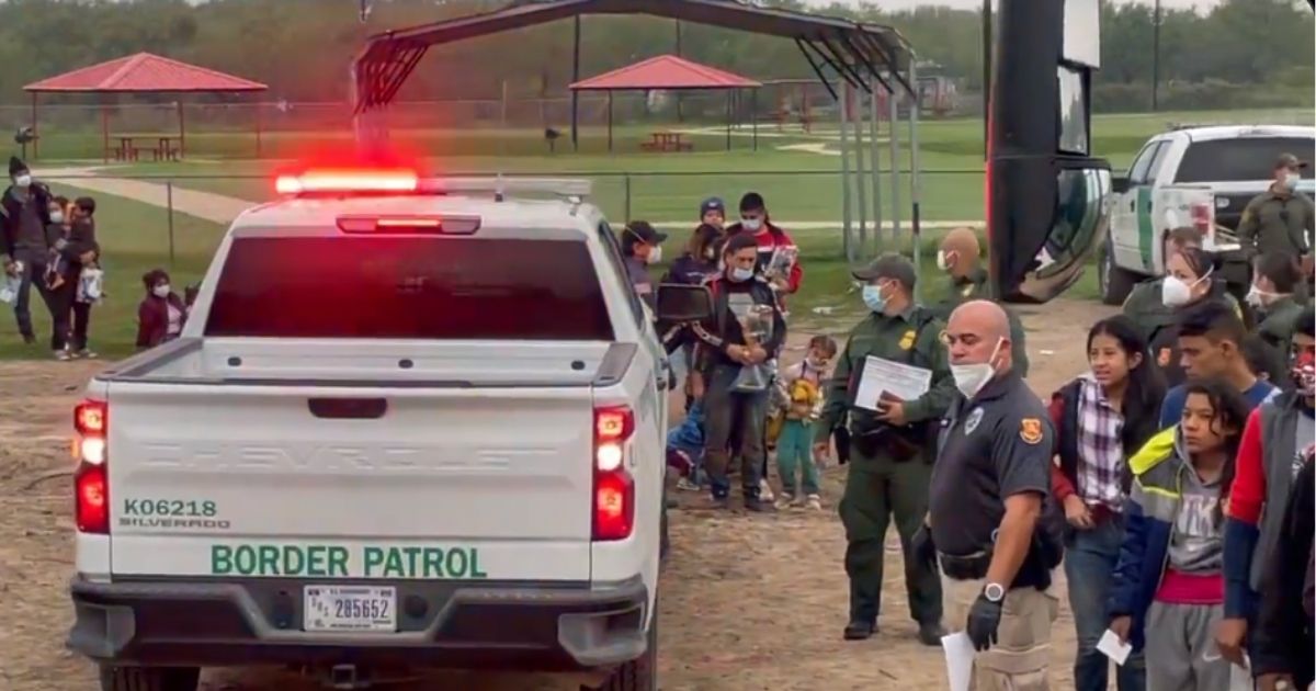 On Dec. 9, hundreds of migrants crossed the U.S. Mexico border near La Joya, Texas, with border patrol buses waiting to collect them and agents watching without being able to stop those crossing.