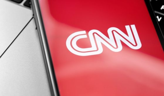 The CNN logo is seen on a cellphone screen in this stock image.