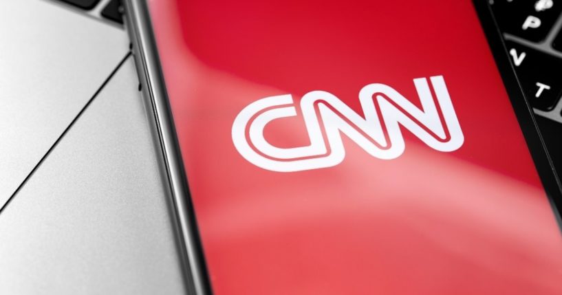 The CNN logo is seen on a cellphone screen in this stock image.