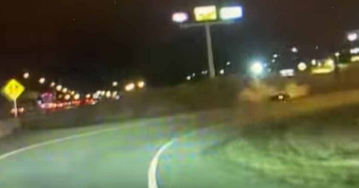 A fleeing vehicle is seen on police dashcam footage leaving the roadway and splashing into a retention pond with the driver and two small children inside.