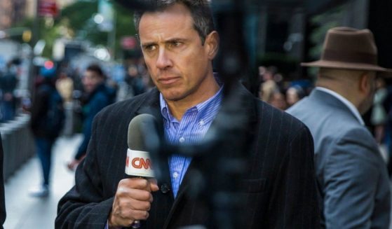 Former CNN reporter Chris Cuomo gives a report in front of the Time Warner Building in New York City on Oct. 24, 2018. Cuomo was fired from the network on Saturday after an investigation into the role he played in helping his brother, former New York Gov. Andrew Cuomo, with his sexual harassment charges.