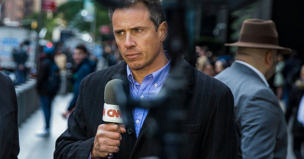 Former CNN reporter Chris Cuomo gives a report in front of the Time Warner Building in New York City on Oct. 24, 2018. Cuomo was fired from the network on Saturday after an investigation into the role he played in helping his brother, former New York Gov. Andrew Cuomo, with his sexual harassment charges.