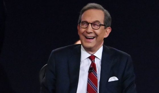 Moderator and Fox News anchor Chris Wallace speaks with then-candidate Joe Biden at the first presidential debate at the Health Education Campus of Case Western Reserve University on Sept. 29, 2020, in Cleveland, Ohio.