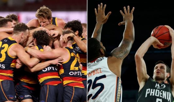 At left, the Adelaide Crows celebrate a goal against the North Melbourne Kangaroos at Adelaide Oval in Australia on Aug. 22. At right, Ben Madgen of the South East Melbourne Phoenix shoots the ball during an NBL match against the Cairns Taipans in Melbourne, Australia, on Dec. 15, 2019.