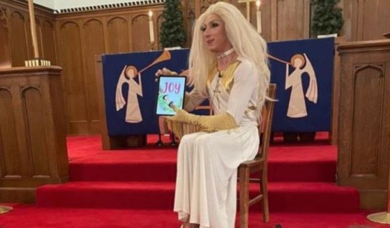 Seminarian Aaron Musser dresses up in drag to read a book in St. Luke’s Lutheran Church of Logan Square in Chicago, Illinois.